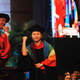 The university president joins Wan in making a “cheers” gesture.